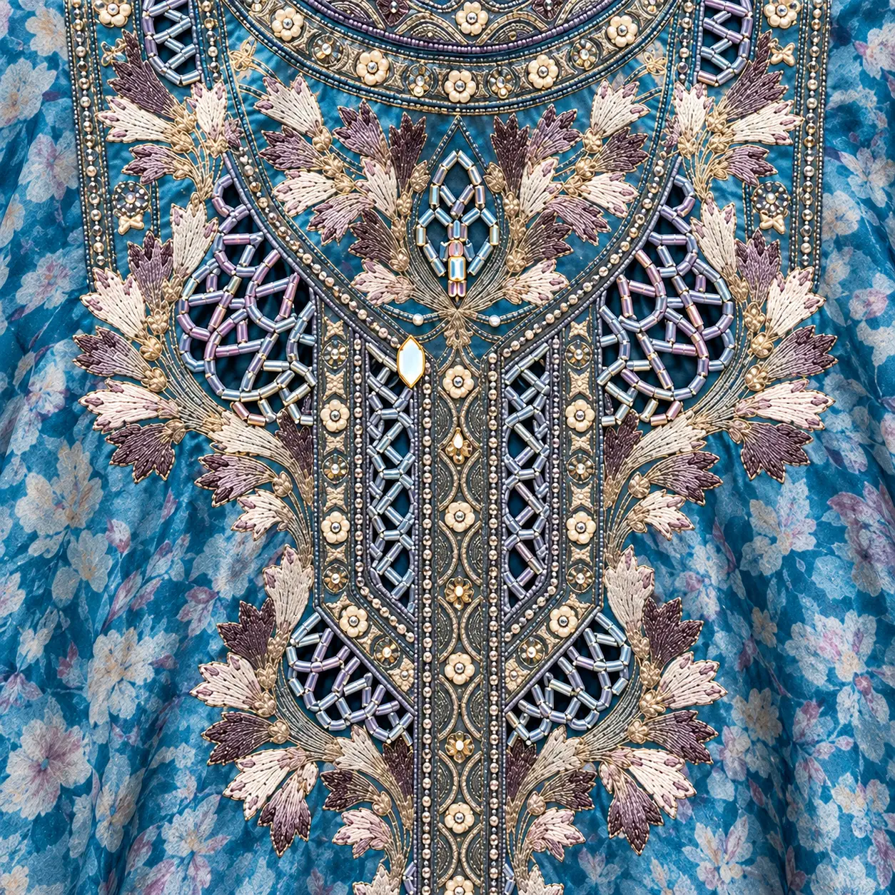 Teal floral embroidery with silver-toned detailing